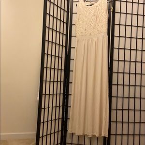 Cream colored elegant dress.